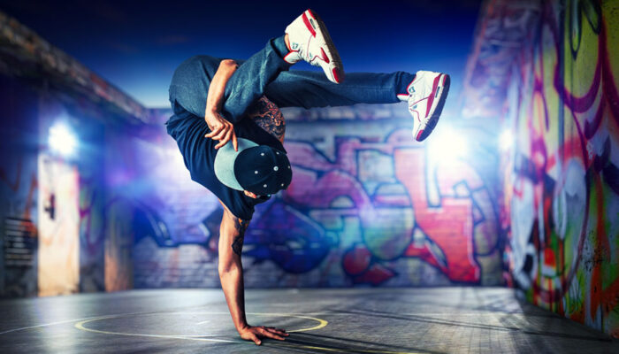 Man breakdancing is a representation of flexible order management